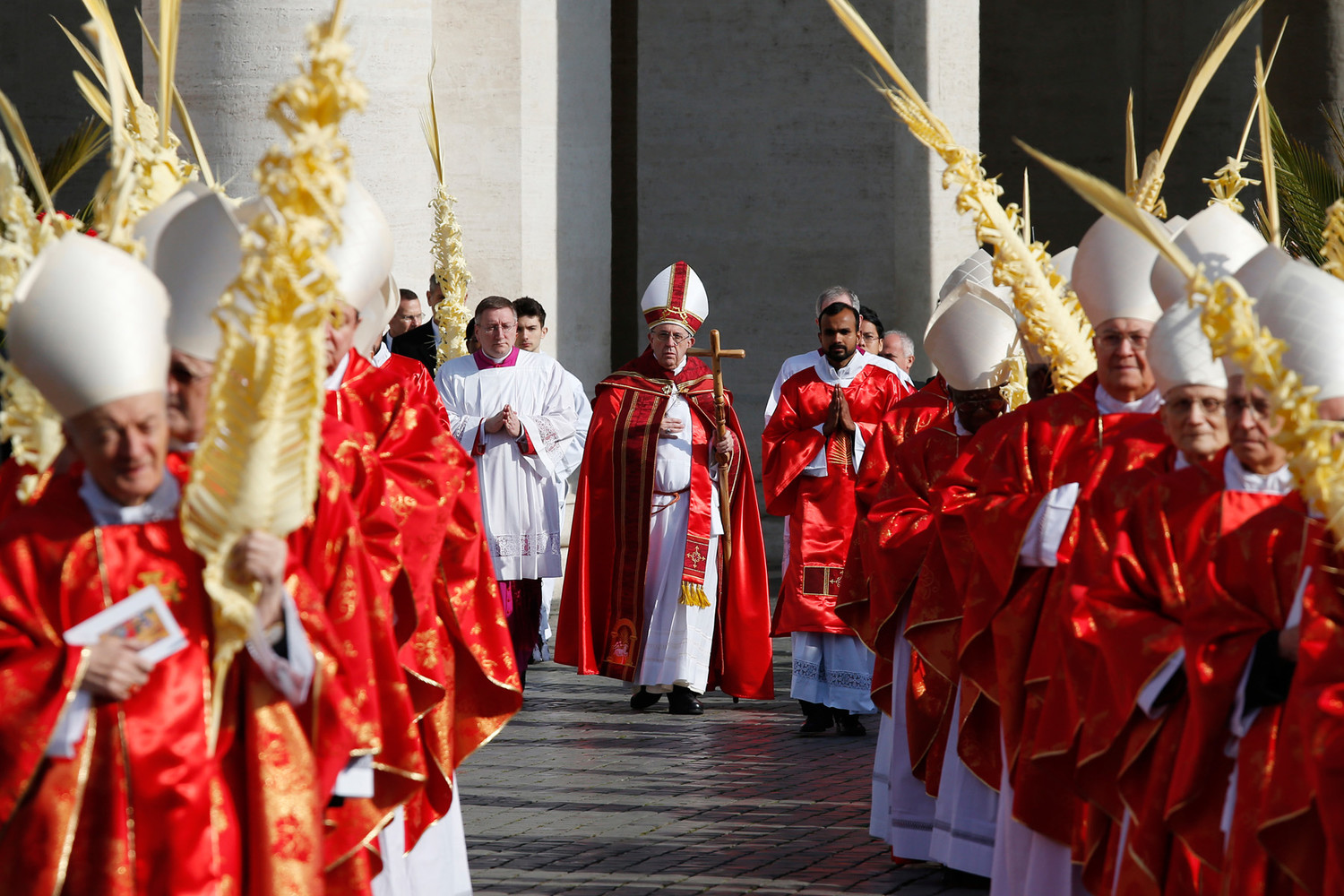 Pope Francis arrives in procession to celebrate Palm Sunday Mass in St. Peter's Square at the Vatican March 25.